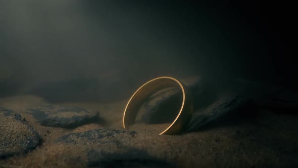 Gold Ring Deep Underwater On The Rocks