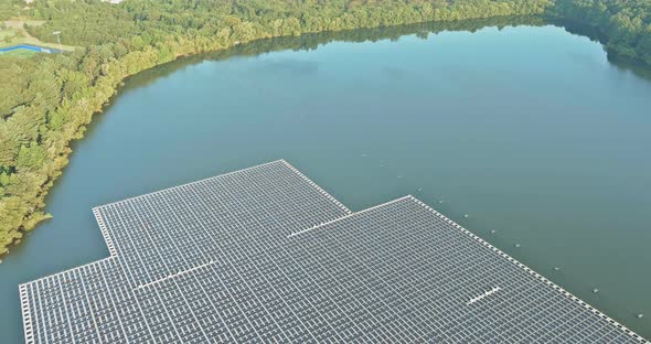 Aerial View of Floating Solar Power Station with Produces Green Environmental Friendly Energy in