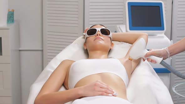 Young Woman on Laser Epilation Procedure