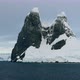 WS Lemaire Channel with snow covered rocks at sunset / Antarctica - VideoHive Item for Sale