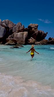 Anse Source d'Argent La Digue Seychelles Young Women on a Tropical Beach During a Luxury Vacation in