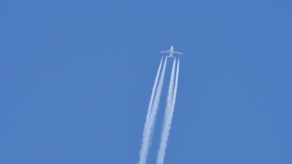 Contrails of a Four Engines Jet Airliner