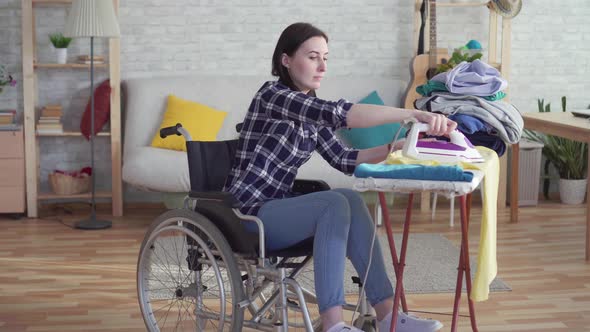 Portrait of Young Woman Disabled Housewife Doing Homework