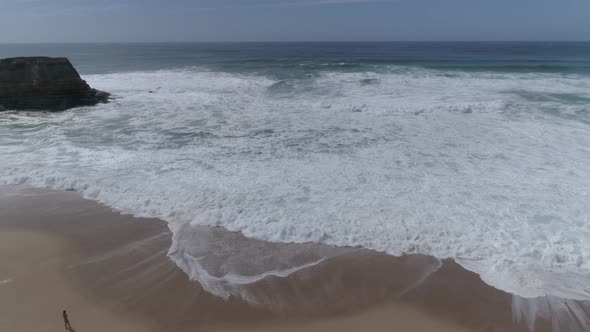 Rolling Waves Onto Beach