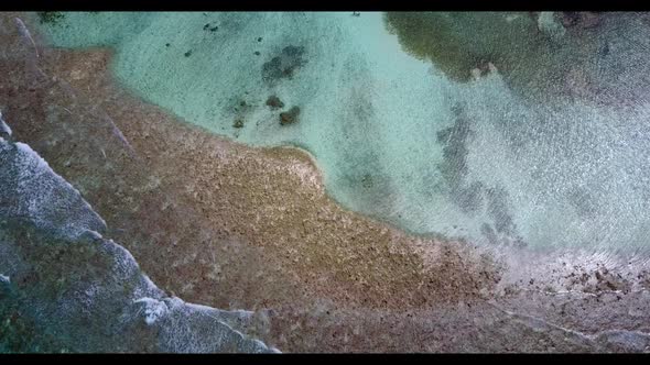 Aerial top view seascape of marine coast beach trip by turquoise sea and white sandy background of a