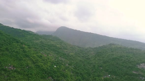 Aerial View of Country Village in the Mountains Filled with Lush Tropical Greenery