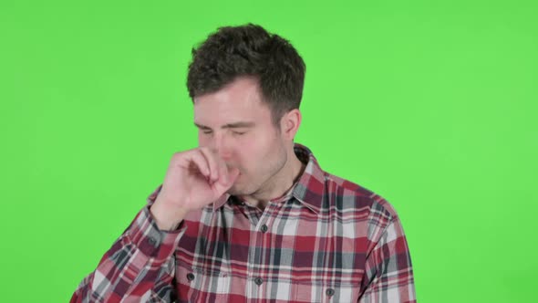 Portrait of Young Man Coughing Green Chroma Screen