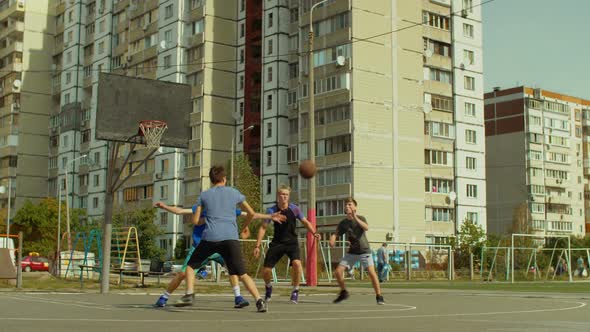 Teen Streetball Players Playing Basketball Game