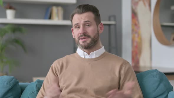 Portrait of Man Talking on Video Call