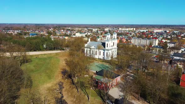 Aerial Shot of Birzai St. John the Baptist Church on the Southern Coast of the Lake Širvėna