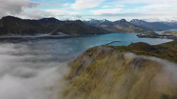 Aerial view of Unalaska Bay with fog, Alaska, United States.