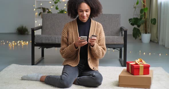 Afro American Ethnic Mixed Race Young Adult Girl Generous Woman Buying Presents Online Via Phone