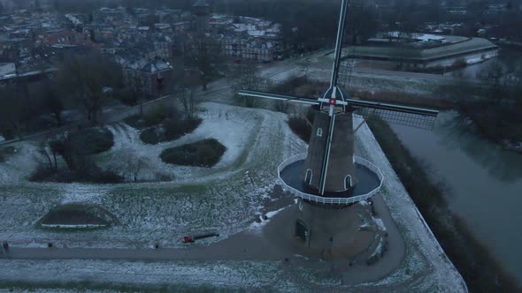 Closed Old Mill In Town Of Gorinchem During Winter Along Linge River In Netherlands. - aerial