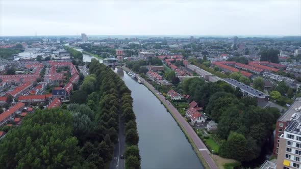 Aerial shot of road and river flowing through city in the Netherlands