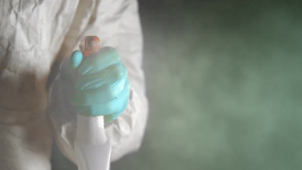 Super Slow Motion Shot of Hand Spraying Disinfection Against the Camera at 1000 Fps.