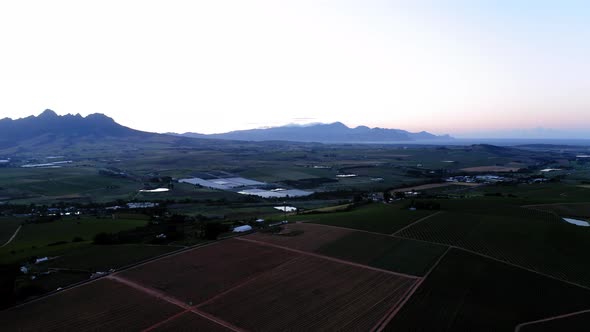 Aerial drone, dusk sunrise over farm land close-up of brown vineyards,, ponds, dams and vineyards, l