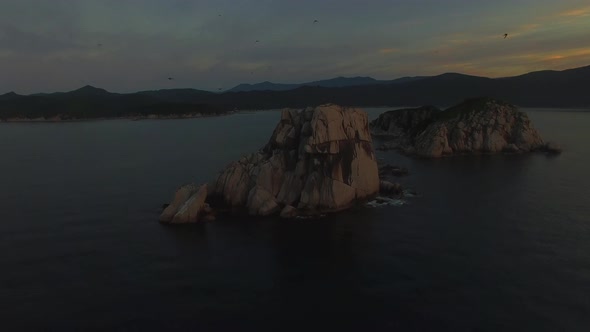 View From a Drone To a Beautiful Island in the Triozerie Bay at Sunrise