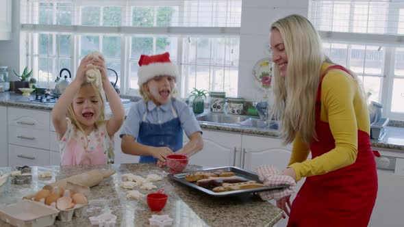 Family making Christmas cookies at home