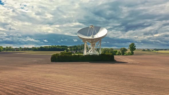 Astronomical observatory to observation the sky on brown field. alt
