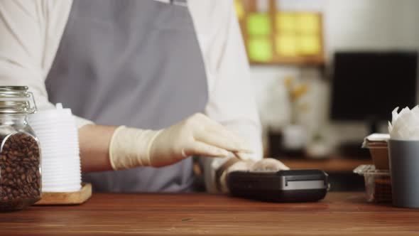 Paying with Smartphone Closeup Using NFC Technology in a Restaurant