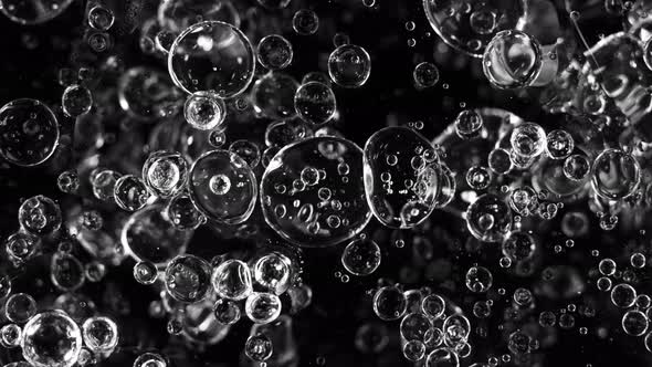 Super Slow Motion Shot of Moving Blue Bubbles Isolated on Black Background at 1000Fps