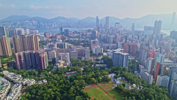 A dynamic aerial footage of the cityscape of Mong Kok area in Kowloon, Hong Kong. It is one of the m