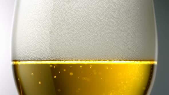 Extreme close-up beer bubbles in a glass, Slow Motion