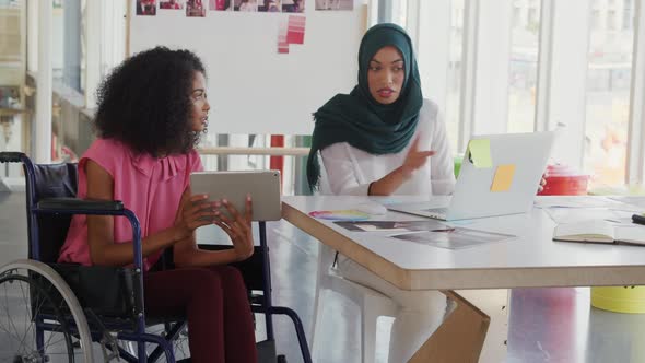 Young women working in a creative office