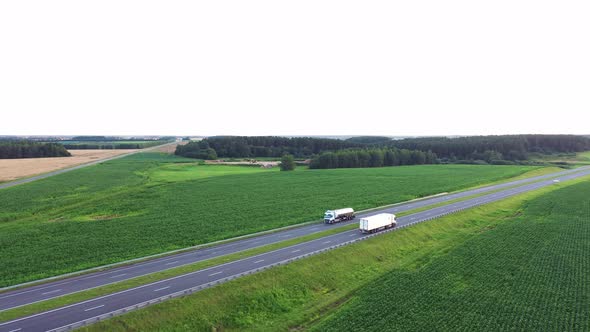 Aerial View Truck With Trailer And Fuel Truck Is Driving On Intercity Highway