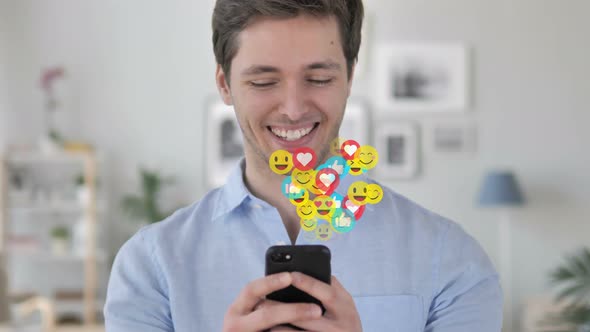 Happy Man Text Messaging on Smartphone