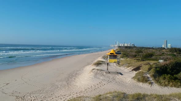 A lifesaving tower positioned on a remote beach using solar panels for energy