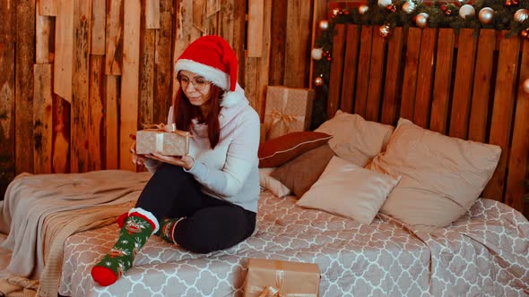 Smiling Woman with Christmas Gift