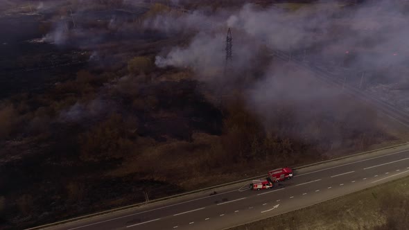 Fire, Dry Grass Lanes in Fire, Firefighters at Work, Disaster, Ecological Catastrophe