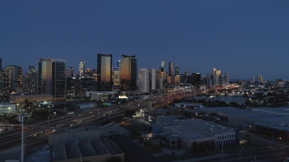 Approaching Melbourne City at dusk highway traffic in foreground