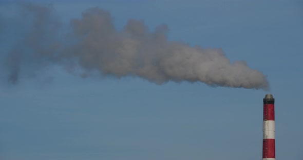Smoke and air pollution from a incinerator chimney near Caen, Normandy, France.