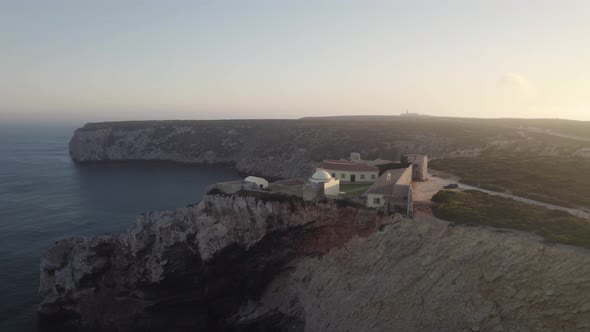 Seascape view of Fortress of Beliche located on top of rugged cliff in Sagres Algarve Portugal.