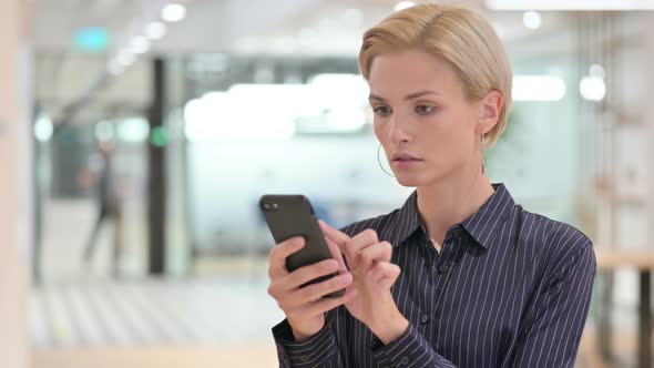 Young Businesswoman Using Smartphone 