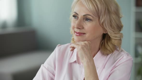 Smiling Woman Satisfied With Her Pension Plan, Happy Retiree Looking Into Camera