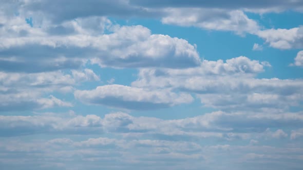 Cumulus Cirrus Clouds Move in the Blue Sky. Time Lapse.