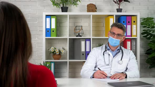 Doctor communicates speaks listens patient, client tells symptoms disease