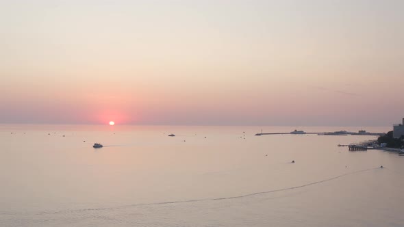 Aerial Shot Flying Over Beautiful Seascape at Dramatic Sun Sunset Sky Horizon of Touristic City