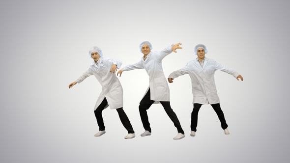 Young men doctors dancing break dance on gradient background.