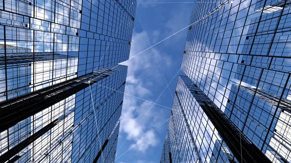 business towers, camera animation among high-rise buildings with blue reflective sky.