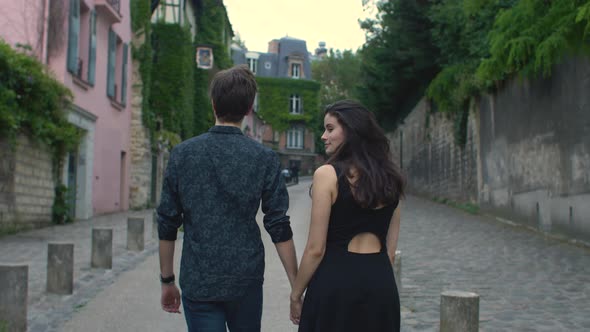 Couple walking in the streets of Paris, France