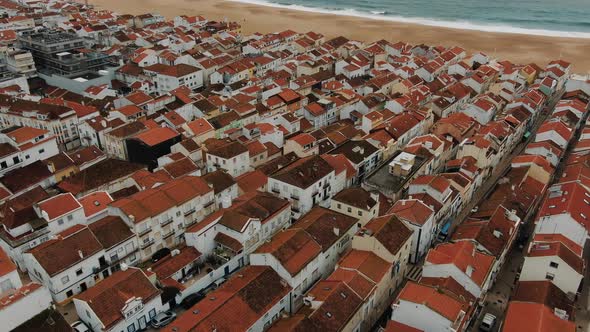 Beautiful Panorama of a European City with Tiled Roofs on the Ocean, Stunning Views From the Drone