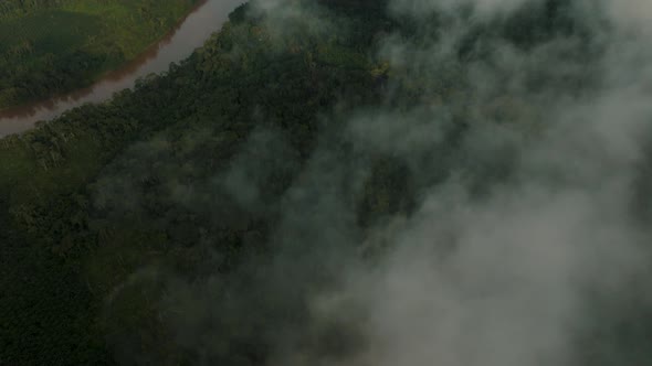 Vivid Clouds Over Tropical Rainforest Trees And River In The Amazon Of Ecuador. Aerial Drone Shot