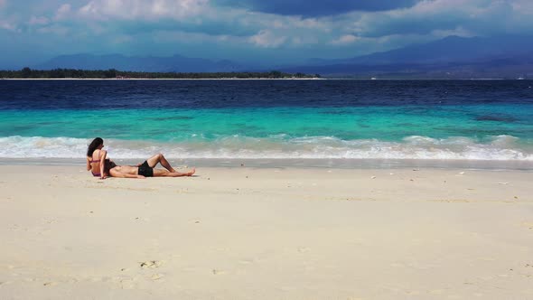 Romantic Couple on Honeymoon Vacation Enjoy Life on Beach on White Sand