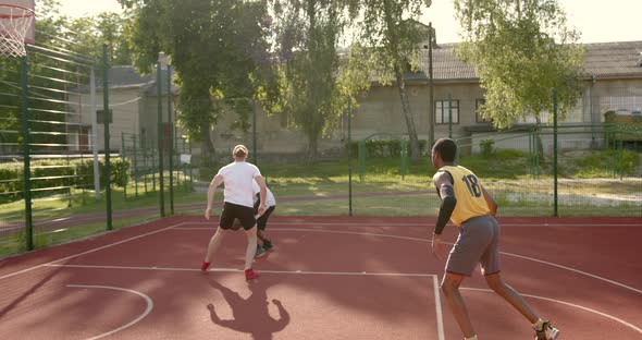 Basketball Players Have a Training Outdoor at Playground