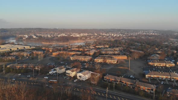 Aerial View Over the Small Town While Rooftops in Autumn Time