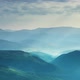 Sunbeams and Clouds Over Wooded Mountains - VideoHive Item for Sale